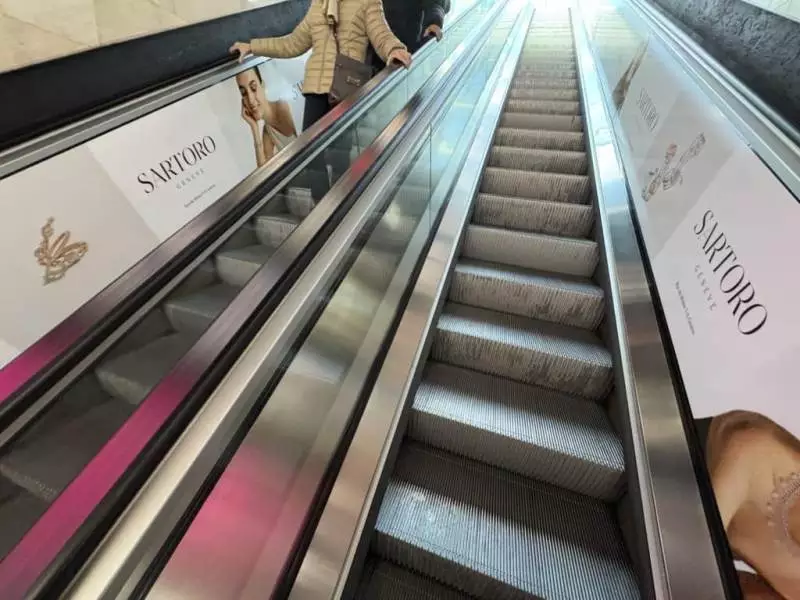 Sartoro prestige poster on the escalators of the Mont-Blanc car park in Geneva - Force Promotion