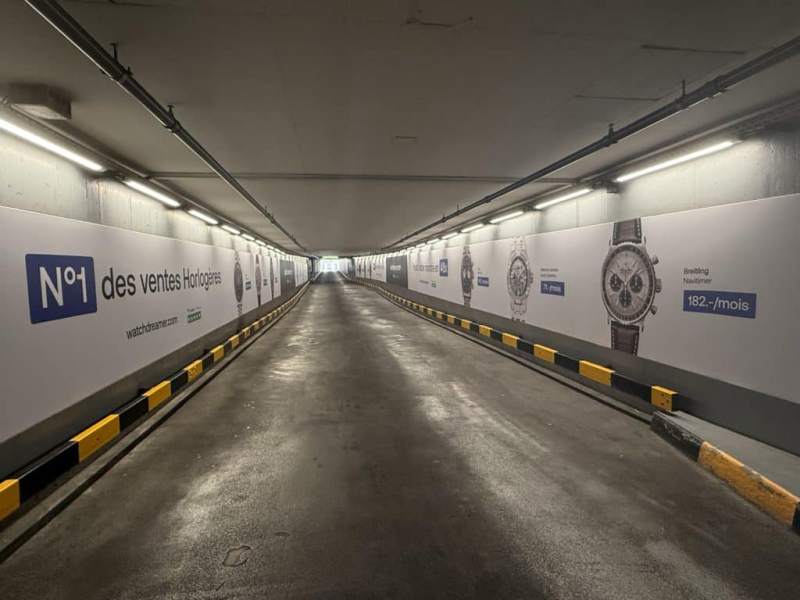 Large-format, face-to-face megaposters for the Watch Dreamer campaign, installed at the Rive droite exit of the Mont-Blanc car park in Geneva, visible from the banners.